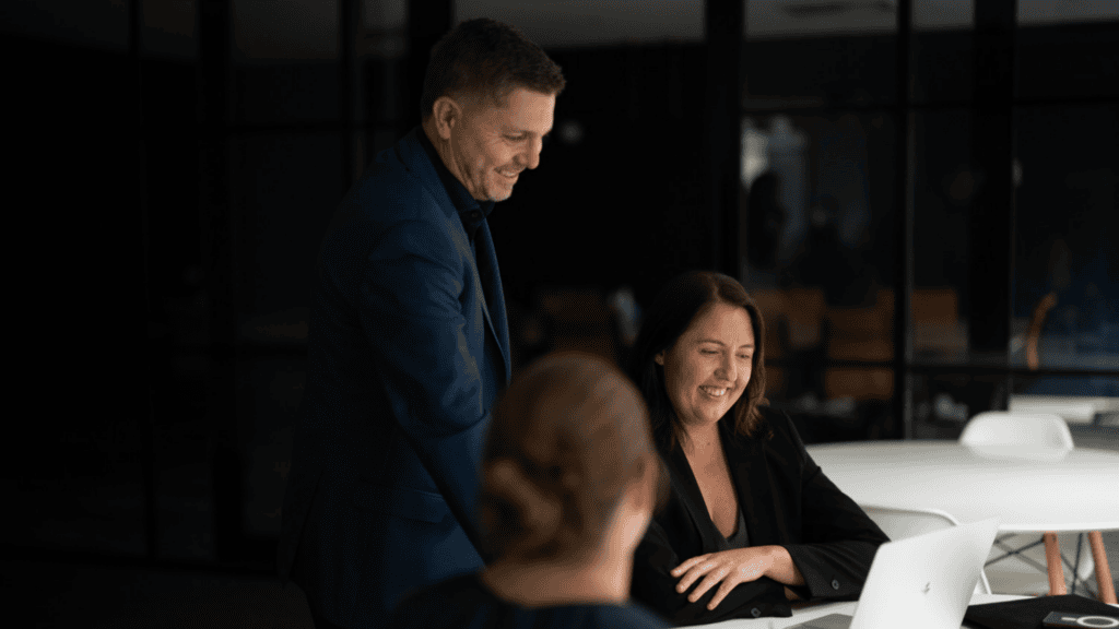 Rod Rossi & Alethea Rose - Directors, q4 financial looking over a laptop.