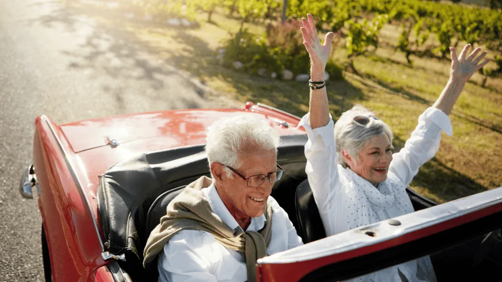 Retired comfortable in a convertible car on holidays