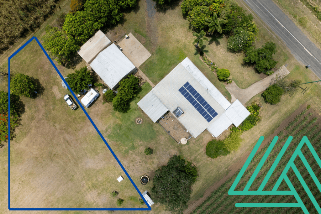 aerial view of house and land sectioned off for subdivision