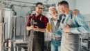 Father and sons in brewery as family business.