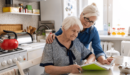 Mother with Daughter reviewing important documents together.