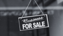 Sign outside a store saying Business for Sale